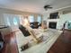 Warm living room featuring hardwood floors, a fireplace, and comfortable seating arrangements at 2347 Devine St., Georgetown, SC 29440