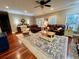 Cozy living room with hardwood floors, area rug, leather furniture, and ample natural light at 2347 Devine St., Georgetown, SC 29440