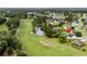 Aerial view of neighborhood homes along golf course, with a pond at 428 Meadow View Ct., Longs, SC 29568