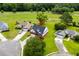 An aerial view of a home with well-manicured lawn and community golf course at 428 Meadow View Ct., Longs, SC 29568