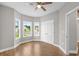 Bright bedroom with two windows and luxury vinyl plank flooring at 428 Meadow View Ct., Longs, SC 29568