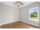 Bedroom with luxury vinyl plank flooring and large window at 428 Meadow View Ct., Longs, SC 29568