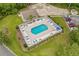 Aerial view of the community pool with ample seating and well-maintained landscaping at Aberdeen Country Club at 428 Meadow View Ct., Longs, SC 29568