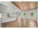 Open living space with hardwood floors, fireplace, and a kitchen with stainless steel appliances at 428 Meadow View Ct., Longs, SC 29568