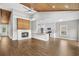 Open living area featuring hardwood floors, a wood ceiling, a fireplace, and an open kitchen at 428 Meadow View Ct., Longs, SC 29568