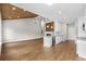Spacious open-concept living area with fireplace, hardwood floors, and a modern kitchen at 428 Meadow View Ct., Longs, SC 29568