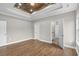 Primary bedroom featuring wood ceiling accent and access to ensuite bathroom and walk-in closet at 428 Meadow View Ct., Longs, SC 29568