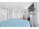Comfortable bedroom features a closet, mounted TV, and window blinds at 6001-S32 S Kings Hwy., Myrtle Beach, SC 29575
