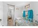 Cozy bedroom features accent wall and curtains, adjacent to bathroom at 6001-S32 S Kings Hwy., Myrtle Beach, SC 29575