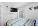 Nautical themed bedroom with mounted TV, coastal decor, and window at 6001-S32 S Kings Hwy., Myrtle Beach, SC 29575
