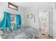 Charming bedroom with accent curtains and bed, adjacent to bathroom at 6001-S32 S Kings Hwy., Myrtle Beach, SC 29575