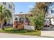 Charming home exterior with inviting deck, patio furniture, and landscaping at 6001-S32 S Kings Hwy., Myrtle Beach, SC 29575