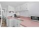 Functional kitchen with white cabinets and appliances, offering plenty of counter space at 6001-S32 S Kings Hwy., Myrtle Beach, SC 29575