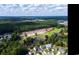 Overhead shot showing the community neighborhood with pond and golf course view at 9742 Indigo Creek Blvd., Murrells Inlet, SC 29576