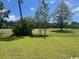 Backyard view features verdant landscape, peaceful pond and golf course in the distance at 9742 Indigo Creek Blvd., Murrells Inlet, SC 29576