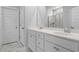 Bathroom features double sinks, marble countertops, a large mirror, and modern fixtures at 9742 Indigo Creek Blvd., Murrells Inlet, SC 29576