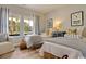 Comfortable bedroom with twin beds, striped curtains, and beach-themed decor at 9742 Indigo Creek Blvd., Murrells Inlet, SC 29576