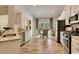 Bright kitchen boasts stainless appliances, granite counters, and a breakfast nook with natural light at 9742 Indigo Creek Blvd., Murrells Inlet, SC 29576