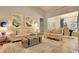 Elegant living room with neutral decor, decorative artwork, and a view into the dining area at 9742 Indigo Creek Blvd., Murrells Inlet, SC 29576