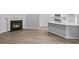 Inviting living space with a cozy fireplace and an open view of the modern kitchen at 9742 Indigo Creek Blvd., Murrells Inlet, SC 29576