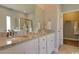 Bathroom features double sinks, granite countertops, and a walk-in closet at 9746 Indigo Creek Blvd., Murrells Inlet, SC 29576