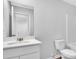 Bright bathroom with vanity, large mirror and toilet at 1534 Clubstone Dr., Conway, SC 29526