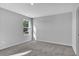 This bedroom has neutral colors, carpet flooring, and a window providing natural light at 1534 Clubstone Dr., Conway, SC 29526