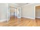 Spacious room featuring hardwood floors and glass French doors to other rooms at 1549 Kensington Ln., Myrtle Beach, SC 29577