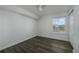 Spacious bedroom with large window, ceiling fan, and neutral walls at 2257 Essex Dr. # E, Surfside Beach, SC 29575