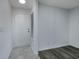 Condo entryway with white door and flooring at 2257 Essex Dr. # E, Surfside Beach, SC 29575