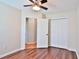 Bedroom featuring hardwood floors, a ceiling fan with light, and a double door closet at 2783 Canvasback Trail, Myrtle Beach, SC 29588