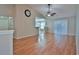 Bright living room with hardwood floors, fan, and sliding doors to let in natural light at 2783 Canvasback Trail, Myrtle Beach, SC 29588