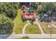 Aerial view of a house, barn, pool, and surrounding land at 374 N Cox Rd., Loris, SC 29569