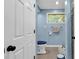 Small bathroom with toilet and blue walls at 374 N Cox Rd., Loris, SC 29569