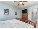 Cozy bedroom features a ceiling fan, a TV atop a wooden dresser and doorway leading to another room at 603 Bucks Trail, Longs, SC 29568