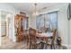 Cozy dining room featuring a wooden table, chairs, and elegant cabinet with natural lighting at 603 Bucks Trail, Longs, SC 29568