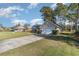 View of a single Gathering home with a well-maintained lawn and driveway at 603 Bucks Trail, Longs, SC 29568
