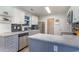Well-lit kitchen with stainless steel appliances, granite countertops, and stylish gray cabinets at 603 Bucks Trail, Longs, SC 29568