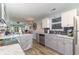 Open kitchen with stainless appliances, granite counters, and seamless flow to the living area at 603 Bucks Trail, Longs, SC 29568