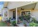 Covered patio offers a relaxed outdoor living space with plants, seating and exterior home views at 603 Bucks Trail, Longs, SC 29568