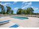 Outdoor pool surrounded by a spacious patio area, perfect for relaxation and recreation at 603 Bucks Trail, Longs, SC 29568