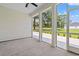 Screened in porch with view of the backyard, landscaping, and trees at 805 Comanders Island Rd., Georgetown, SC 29440