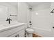 Bathroom featuring modern black hardware, vanity, toilet, and tub at 805 Comanders Island Rd., Georgetown, SC 29440
