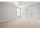 A carpeted bedroom features two closets and natural light at 805 Comanders Island Rd., Georgetown, SC 29440