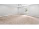 A carpeted bedroom features a ceiling fan and natural light at 805 Comanders Island Rd., Georgetown, SC 29440