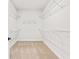 A walk-in closet offers carpeted floors and multiple wire shelves at 805 Comanders Island Rd., Georgetown, SC 29440