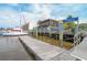 Charming view of a public dock with boats, waterfront dining, and scenic views of the waterway at 805 Comanders Island Rd., Georgetown, SC 29440