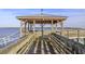 Wooden gazebo on a pier offering scenic views and peaceful waterfront relaxation at 805 Comanders Island Rd., Georgetown, SC 29440