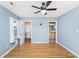 Light-filled bedroom with hardwood floors and ceiling fan at 95 Channing Dr., Little River, SC 29566