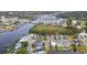 Aerial view of a neighborhood along a river and waterway, marina, and community pond with fountains at 1010 Club House Dr., North Myrtle Beach, SC 29582